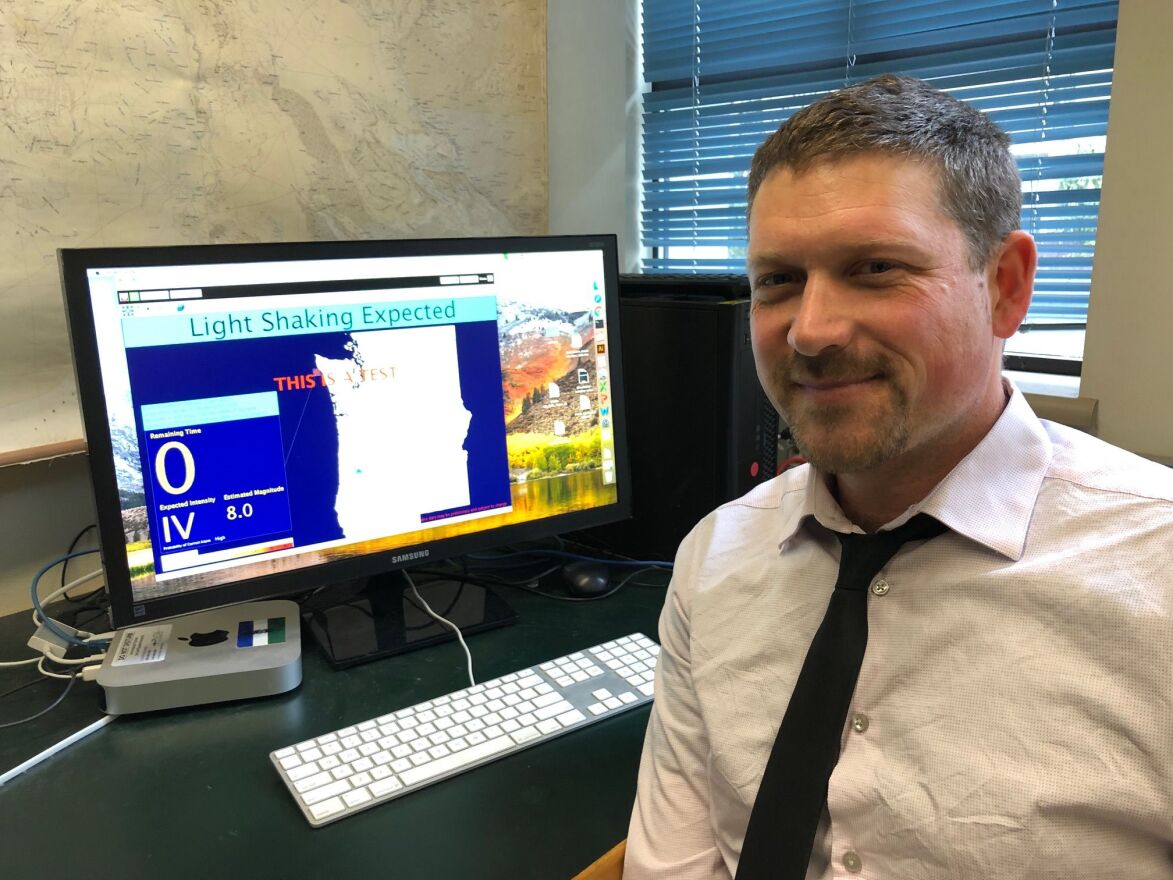 Leland O'Driscoll, Oregon Seismic Network Manager and Earthquake Early Warning Field Seismologist, with the ShakeAlert user display software suite at the University of Oregon.